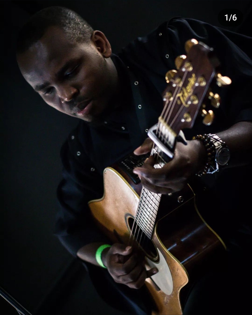 Deo Salvator performing fingerstyle guitar